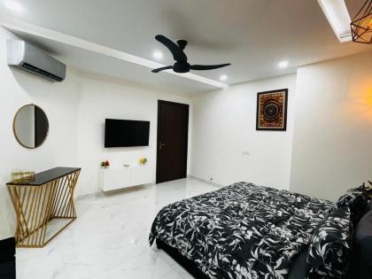 Chic Noir 1 Bedroom Apartment Gulberg - image 10